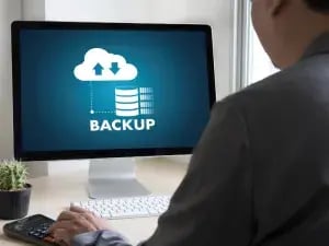 Business man doing a backup of data